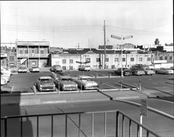 Parking lot and the back of Kentucky Street shops from Keller Street, Petaluma, California, about 1955