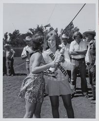 Dairy Princess, Peggy Borges, gets a whisper at the Sonoma County Fair, Santa Rosa, California