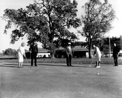 Playing golf at Oakmont Golf Course