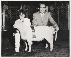 Nancy Bloom and champion fat lamb at the Sonoma County Fair, Santa Rosa, California, July 30, 1961