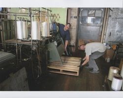 Russell Strickland and Tim Rhodes putting a braiding machine on a pallet, Sunset Line & Twine Company in Petaluma, California, Dec. 5, 2006