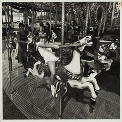 Taking a carousel ride at the Sonoma County Fair, Santa Rosa, California, 1981