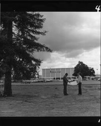 Hugh Codding talking to Sam Gordan at Coddingtown, Santa Rosa, California, March 17, 1963