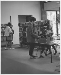 Patrons using the Dagny Juell Boys and Girls Room of the Library