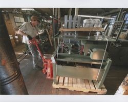 Tim Rhodes loading a piece of machinery at Sunset Line & Twine Company in Petaluma, California, Dec. 2006