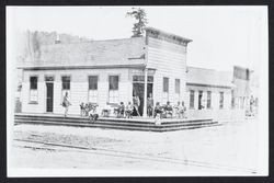 Men sitting out in front of the Joost and Starrett Saloon, Guerneville