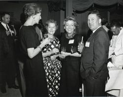 Madeline Rossi, Mary Dei and Jack W. Dei, Sr. and unidentified woman at an unidentified dairy function, about 1963