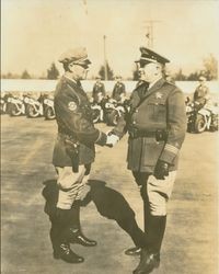 Jack B. Costa and E. Raymond Cato shaking hands, about 1936