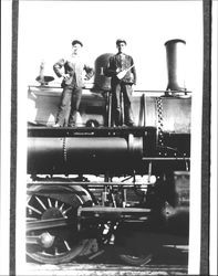 Two men standing on a locomotive, Petaluma, California, 1915