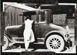 Unidentified women with a 1927 Model Ford coupe in front of the Occidental Post Office, Occidental, California, about 1927