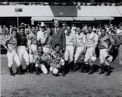 George Murphy, racing steward poses with jockeys at the Sonoma County Fair Racetrack, Santa Rosa, California