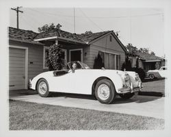 Karl Hullen in his Jaguar at his home, Santa Rosa, California, 1957