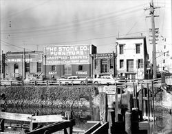 View of Water Street and new pilings near the Washington Street Bridge, Petaluma, California, about 1954