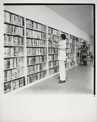 Shelving books at the Geyserville Library, Geyserville, California, 1971