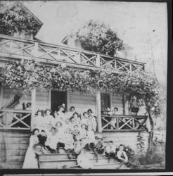 Women and children on porch and steps of Alfonso Franceschi's Garibaldi Saloon