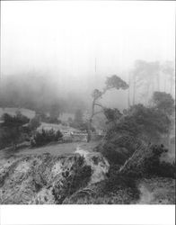 Looking back from rocky point which juts into sea at old private burial ground on farm above Fort Ross, California, July 1949