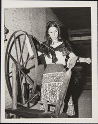 Linda Margarain performs many chores at the Petaluma Adobe, including spinning, grinding corn, candlemaking, baking, etc, Petaluma, California, 1977