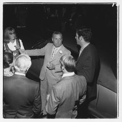 Ed Zumwalt talks to a group of people at the Zumwalt Chrysler-Plymouth Center Open House, Santa Rosa, California, 1971