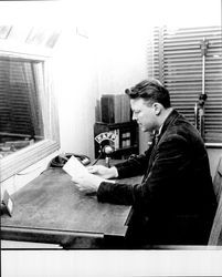 Ted Shields at the microphone of radio station KAFP