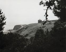 Fort Ross blockhouse and fence viewed from below the bluff at Fort Ross, California, 1970s