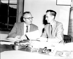 Nelson Smith, postmaster, with assistant post master Peck Van Marter