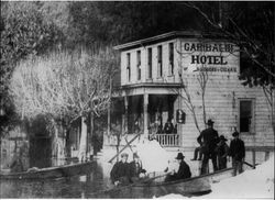 Russian River floodwaters at the steps of the Garibaldi Hotel in Guerneville, California, about 1904?
