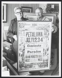 Ed Mannion and Elmer Enquist hold up a framed poster for the first annual Egg-Day and Exhibition at Enquist's frame shop, 141 Kentucky Street, Petaluma, California, 1974