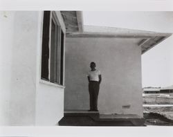 Bud Alwes standing in front of his first house as it undergoes construction, 936 Pacific Avenue, Santa Rosa, California, about 1947