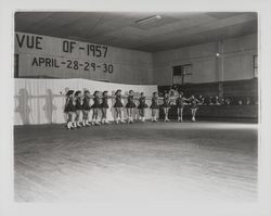 Line of skaters linking arms in the Skating Revue of 1957, Santa Rosa, California, April, 1957