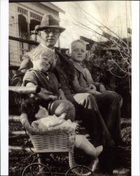 John W. Peoples seated with his two children: Louise and Henry seated in the backyard of their home at 523 Oak Street, Petaluma, California, about 1926