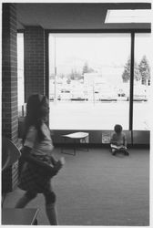 Children reading by the windows in the library