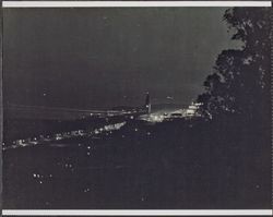 Ferry Building and San Francisco waterfront at night, 1920s