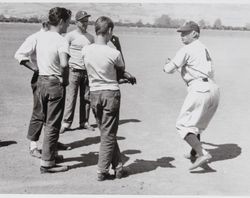Oscar Vitt, an instructor with the San Francisco Examiner Baseball School demonstrates the batting stance for unidentified boys, Petaluma, California, July 1954