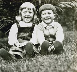 Wilfred Everett Bixby, Jr. and an unidentified girl at the Bixby house, 415 Perkins Street, Oakland, California, about 1911