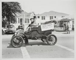 Berkeley Nash and William C. Shipley riding in a 1902 Nash automobile during the 1952 Luther Burbank Rose Festival