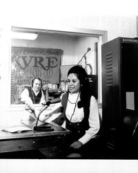 Weather girl at KVRE radio station, Santa Rosa, California, 1971