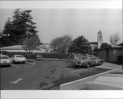 Parking lot between City Hall and Police Station in downtown Petaluma, California, looking east toward Howard Street, 1978