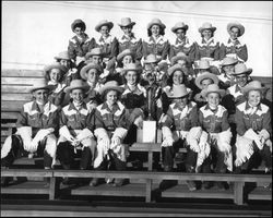 Group portrait of the California Centaurs mounted junior drill team with a trophy in 1947