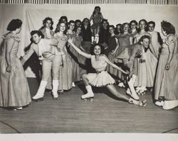 Group photograph of Petaluma Junior High Girls Club performing the minuet on roller skates, 201 Fair Street, Petaluma, California, about 1947