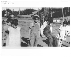 Children playing on swings