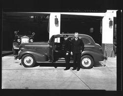 Petaluma, California fire chief with new car, 1938