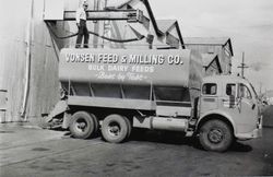 Vonsen Feed & Milling Company truck parked below loading chute on First Street, Petaluma, California, about 1949