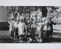 Children at a birthday party posing for a group photograph, Petaluma, California, about 1923