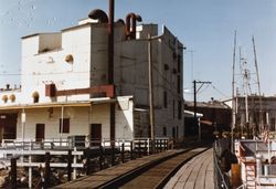 East wall of the Great Petaluma Mill and the Petaluma and Santa Rosa Railroad Trestle, Petaluma, California, about 1975