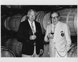 Edward Gauer and Allan Hemphill tasting wine in the cellar, Geyserville, California, 1987