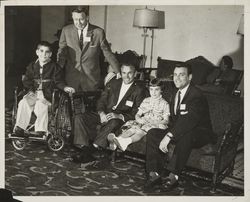 Sport figures with crippled children who participated in the charitable events of the Red Coat Organization, Santa Rosa, California, 1960