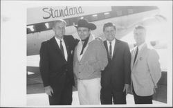 Bill Soberanes with John Agar, James Drury, and unidentified man at the airport, Petaluma, California, about 1964