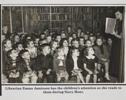 Librarian Emma Jamieson of the Petaluma Carnegie Library reads to children, 20 Fourth Street, Petaluma, California, about 1938