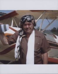 Remo Galeazzi stands by his custom built airplane, Petaluma, California, 1982