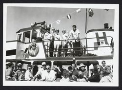 Men and beauty queens welcome the boat Harbor King to Petaluma